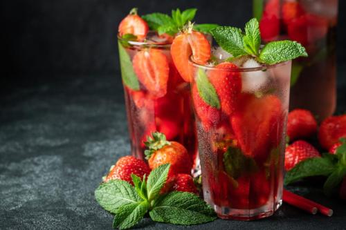 Lemonade with fresh strawberries and mint leaves