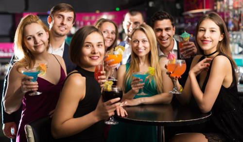 Portrait,Of,Young,Females,And,Males,Celebrating,Corporate,In,The