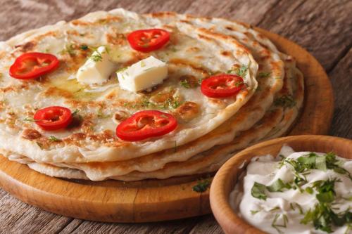 Indian bread with butter and sour cream