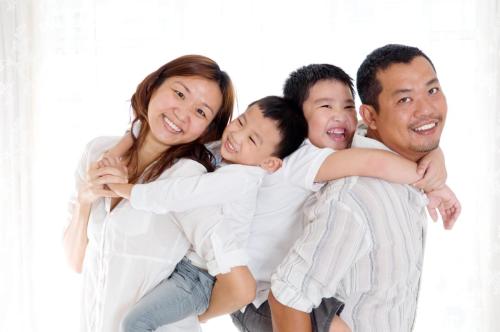 Beautiful indoor portrait of Asian family
