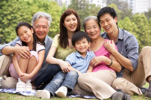 Portrait of Asian family at the park