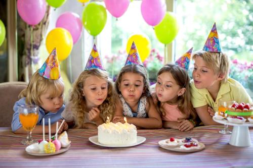 Children,Blow,Out,The,Candles,On,The,Cake