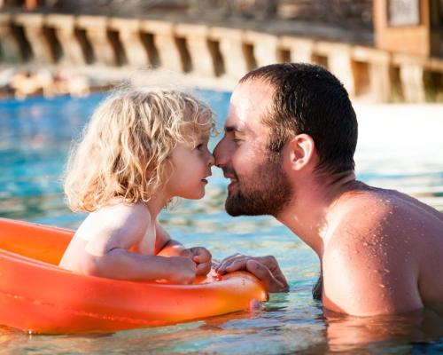 Happy,Child,Playing,With,Father,In,Blue,Water,Of,Swimming