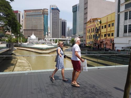 cuople walking at river of life  in Kuala Lumpur, Malaysia