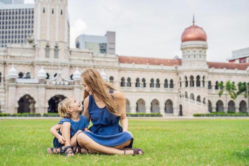 Mom,And,Son,On,Background,Of,Merdeka,Square,And,Sultan